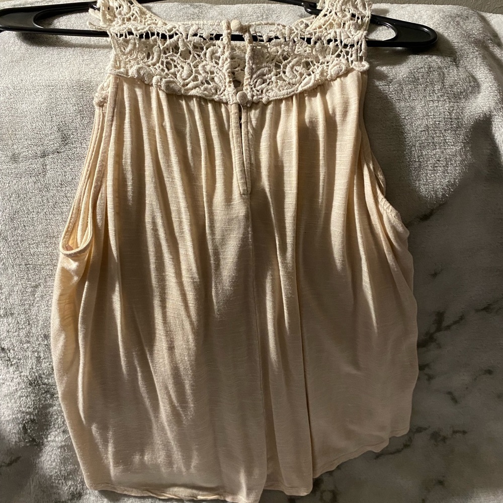 Cream colored top with crochet design chest small
